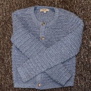 Woman’s Blue Sweater